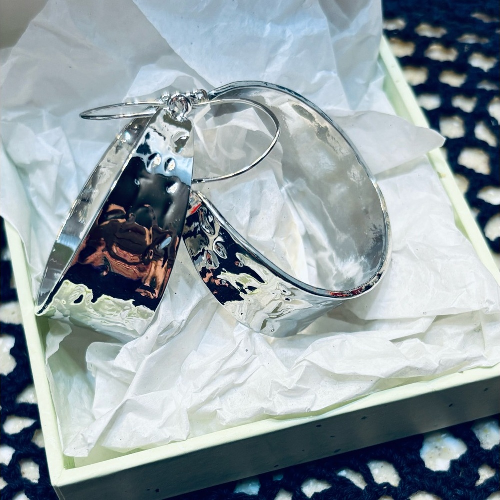 NWOT silver hoop earrings. Never been worn.